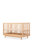 תמונה אחורית של עריסת עץ בגוון בהיר 70X140