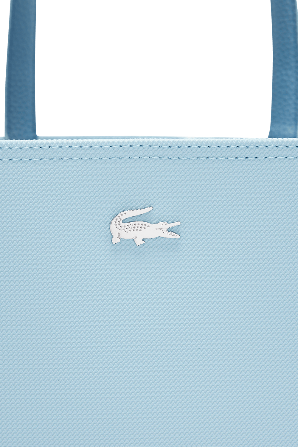 תמונת תקריב של תיק נשיאה דו צדדי LACOSTE