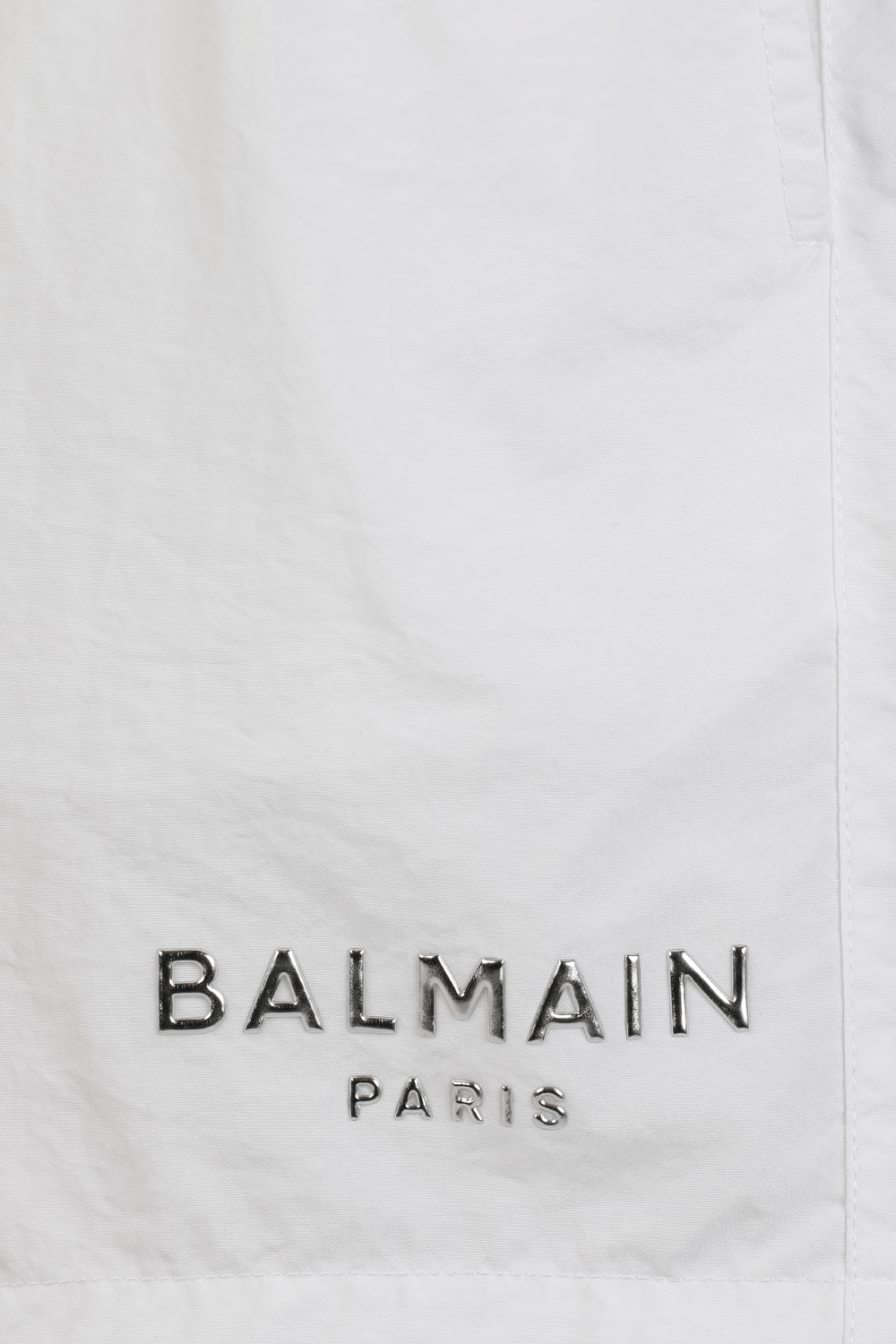 תמונה אחורית של Metallic Logo Swim Shorts in White BALMAIN